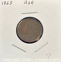 Obverse of 1863 Indian Head one cent coin in flip