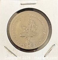 Obverse view in holder showing full coin