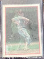 Front of Don Carman Magic Motion card in protective sleeve