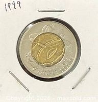 Reverse side showing Inuit drummer design and bilingual legend