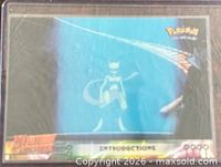 Front view of the card in sleeve showing Mewtwo artwork and title