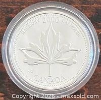 Reverse maple leaf design with 2000 Harmony legend in plastic capsule