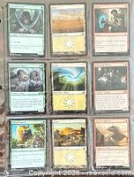 Front view of all nine Magic cards in binder sleeve