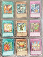 Front of nine Yu-Gi-Oh! cards in binder sleeve