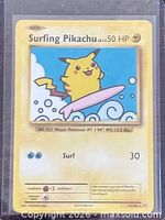 Front of Surfing Pikachu card in sleeve