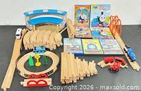 Full lot overview showing tracks, trains, station, DVDs and books