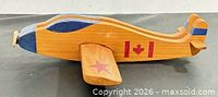 Profile view showing Canadian flag decal and overall shape