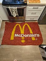 Flag laid flat showing full logo and colors