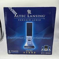 Front of sealed retail box showing Altec Lansing branding and product imagery