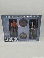 Front view of sealed Tom Strong Deluxe Action Figure Set showing figures and accessory inside box