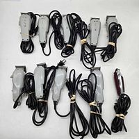 All eleven corded clippers and trimmers laid out