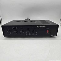 Front view of Bogen C-100B amplifier showing controls and switch