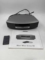 Front view of Bose system with remote and manual