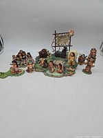 Full lot overview showing all Friends of the Feather figurines grouped on scenic bases