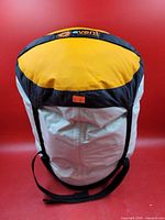 Sleeping bag packed in white/yellow Sea to Summit eVent compression sack with black straps