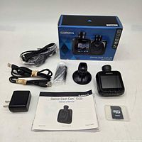 Complete lot showing dash camera, box and all accessories
