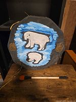 Front of drum showing polar bear artwork and included mallet