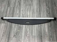 Load cover retracted showing aluminium bar and handle