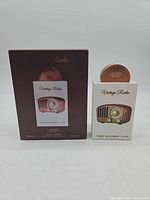 Outer presentation box and perfume bottle in front