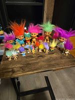 Group shot of all troll dolls on table