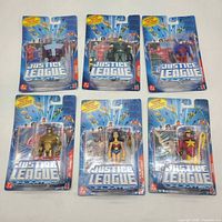 Front view of six sealed Justice League Unlimited action figures