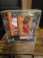 Full view of sealed LeBron James action figure in display case