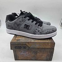 Side view of grey DC Star Wars Manteca 4 shoes on original box