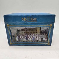 Front of blue slipcase box showing series artwork