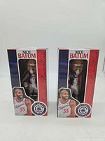 Front view of both boxed Nico Batum bobbleheads