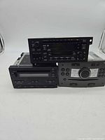 Front view showing three car stereo head units