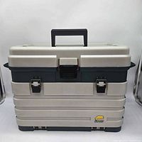 Front view of closed Plano tackle box showing handle, latch, and exterior