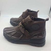 Side view of both boots showing color, style and condition