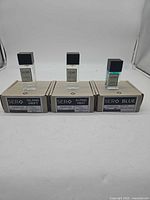 Front view of three boxed 50 mL SERO parfums: Island Drift, Alpine Mist, Blue
