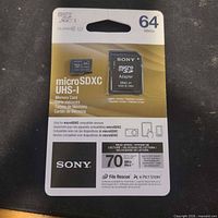 Front view of sealed Sony 64GB microSDXC UHS-I package showing card and adapter