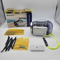 Full lot overview showing housing, box, accessories laid out