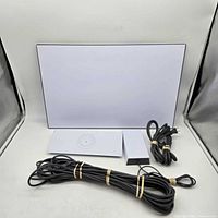 Complete Starlink Gen 3 kit showing dish, router, power supply, long data cable, and power cable