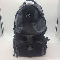 Front view showing overall design, logo patch, buckle, compartments