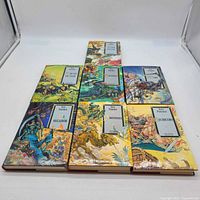All seven hardcover Discworld novels laid out showing front covers