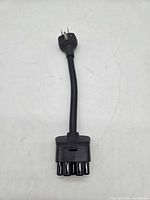 Full view of adapter showing both ends and cable