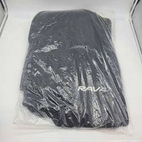Sealed package showing black carpet mat with embroidered RAV logo