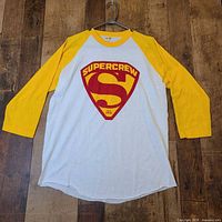 Front view of raglan tee showing Supercrew logo and sleeve color contrast