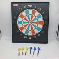 Full view of Unicorn dartboard with six darts displayed