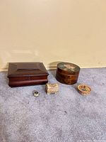 Five boxes arranged closed to show scale and exterior finishes