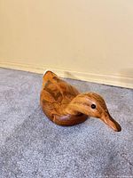 left side view of carved wood duck
