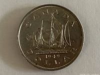 Reverse showing ship design and 1949 date