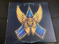 Front cover with winged A logo