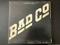 Front jacket with BAD CO text