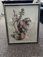 Full view of framed print showing violin illustration and frame