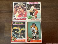 Fronts of the four Bobby Orr cards showing team names and images