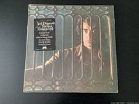 Front cover of LP showing title sticker and artist image